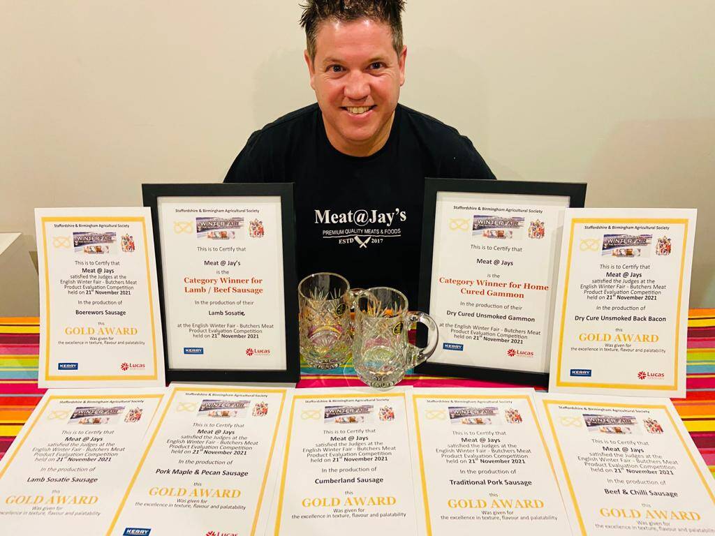 Jay with his Gold Award certificates from the English Winter Fair Butchers Meat Product Evaluation Competition